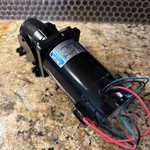 Leeson CM34D25NZ7C Dc Right Angle Gearmotor, 1/8 Hp - 90 V, 125 Rpm 20 Ratio New. Fixed Price $475.00.