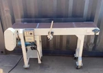 Conveyor With Leeson Motor And Speed Control. 12 Wide 60 Long 33 Height. Fixed Price $2400.00.